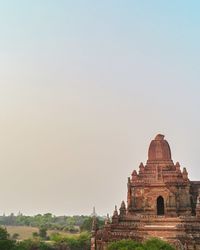 Old temple against clear sky