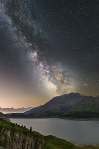 Scenic view of sea against sky at night