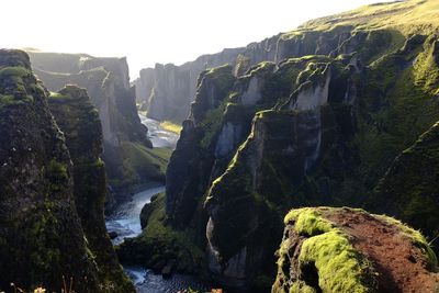 Scenic view of waterfall against sky