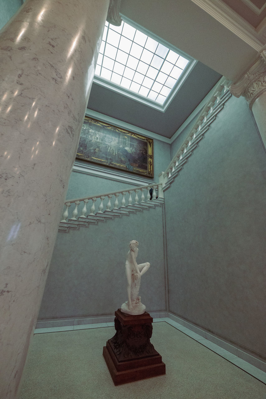 architecture, floor, sculpture, ceiling, statue, indoors, human representation, no people, representation, history, built structure, room, the past, flooring, wall, craft, interior design, building, plaster