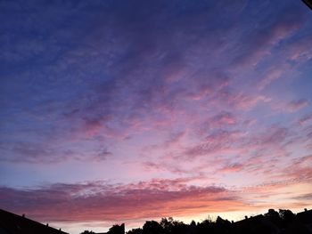 Low angle view of dramatic sky during sunset