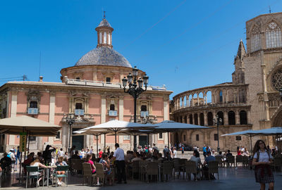 People in front of historic building