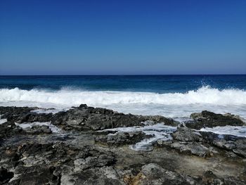 Scenic view of sea against clear sky