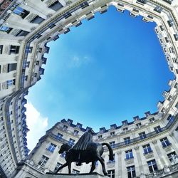 Low angle view of building against blue sky