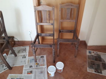 High angle view of chairs and table at home