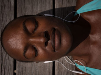 Close-up of woman against wall