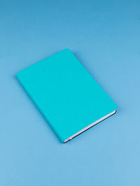 High angle view of pen on blue background