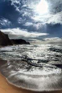 Scenic view of sea against cloudy sky