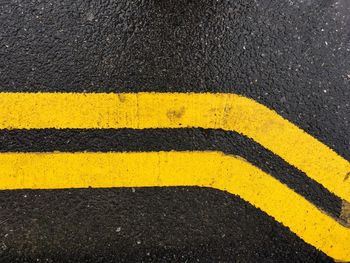 Close-up of yellow zebra crossing on road