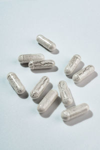 Close-up of pills on white background