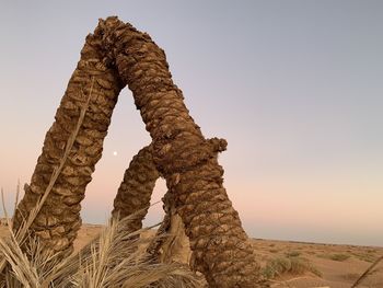 Low angle view of rock formation against clear sky