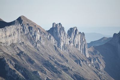 Panoramic view of snowcapped mountains against sky