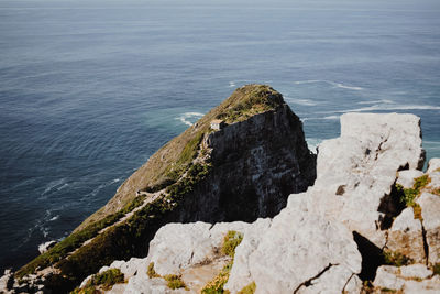 High angle view of rocks at sea shore