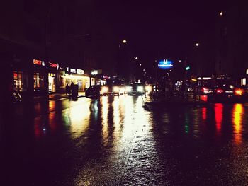 Wet road in city at night
