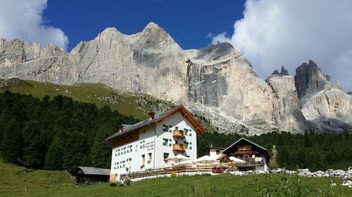 Panoramic view of houses and mountains against sky