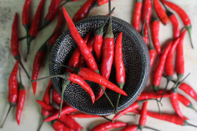 Close-up of red chilies in container