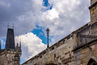 Low angle view of street amidst buildings against sky