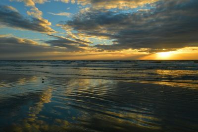 Scenic view of sea at sunset