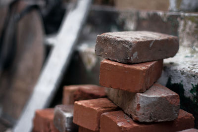 Close-up of rusty stack on wood