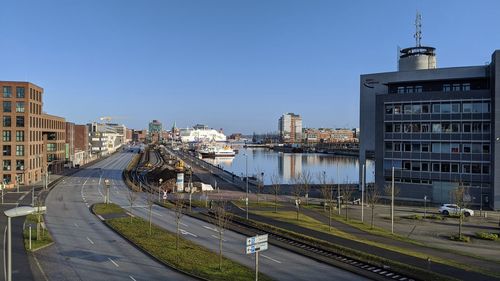 View of buildings in city against clear sky