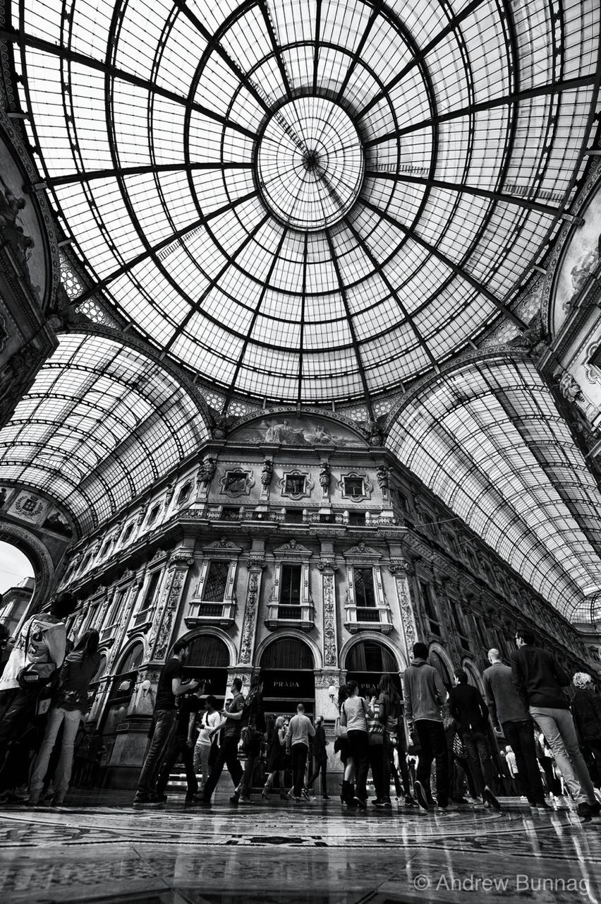 indoors, architecture, ceiling, built structure, low angle view, architectural feature, arch, pattern, skylight, interior, window, shopping mall, design, building exterior, incidental people, glass - material, travel destinations, travel, famous place, railroad station