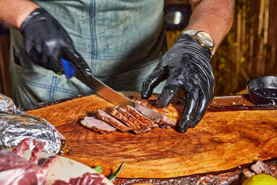 Midsection of man preparing food