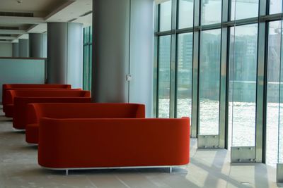 Empty chairs and tables in building