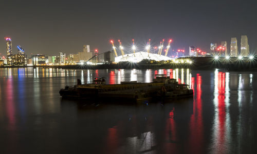 Reflection of illuminated buildings in water at night