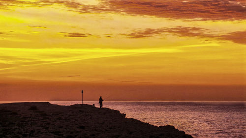 Scenic view of sea at sunset
