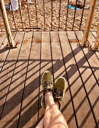 Low section of person on footbridge