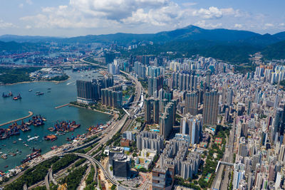 High angle view of buildings in city against sky