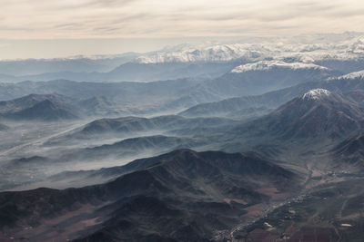 Aerial view of mountains in foggy weather