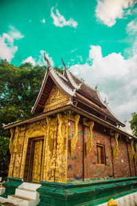 Low angle view of temple against building