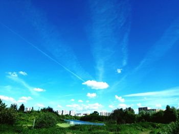 Scenic view of landscape against blue sky