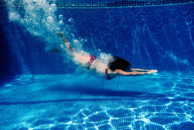 Man swimming in pool