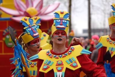 Full length of multi colored umbrellas in traditional clothing