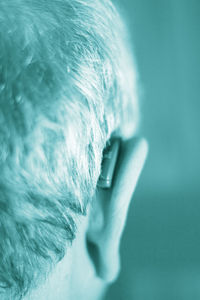 Close-up of man wearing hearing aid