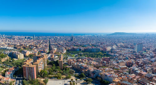 High angle view of townscape against clear blue sky