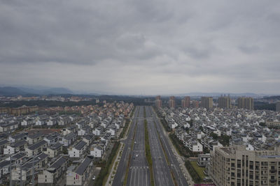 High angle view of buildings in city against sky