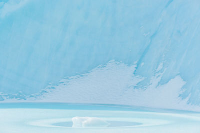 Small ice formation in front of large ice berg, greenland.