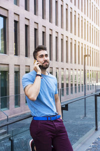 Portrait of young man against camera