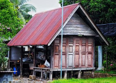 Exterior of old house on field