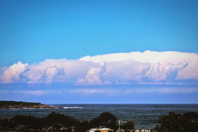 Scenic view of sea against blue sky