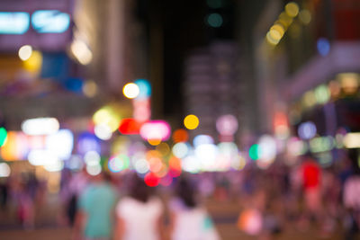 Defocused image of illuminated city at night