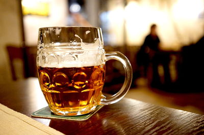 Close-up of beer in glass on table