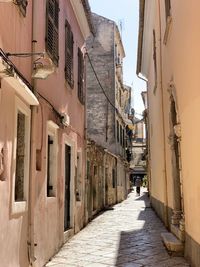 Narrow alley amidst buildings in town