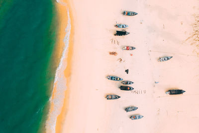 Aerial view of boats moored on shore at beach