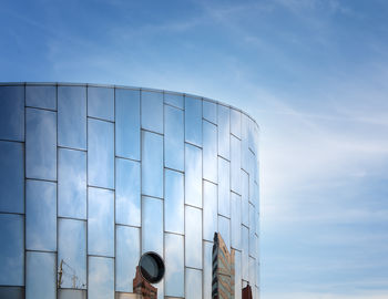 Low angle view of modern buildings against sky