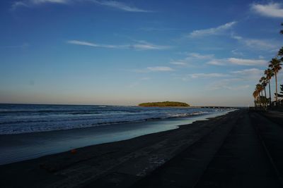 Scenic view of beach against sky during sunset