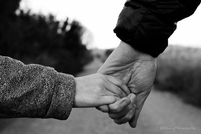 Close-up of hand holding hands